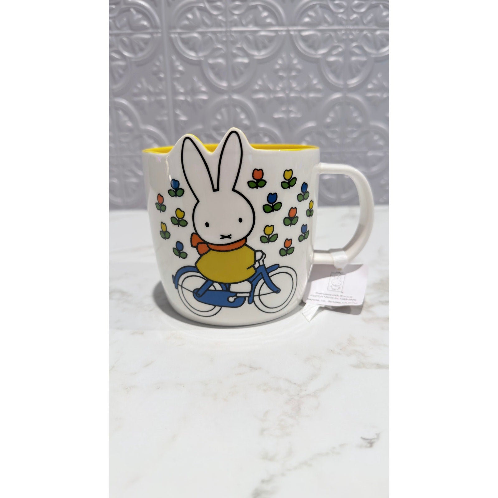 Miffy By Magenta Bunny On Bike Flowers Ceramic Coffee Mug Yellow Interior NWT